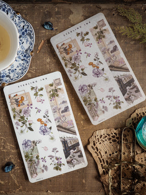 Vintage sticker strips featuring a botanical collage design of muted purple flowers, sepia-toned illustrations, and antique architectural sketches.