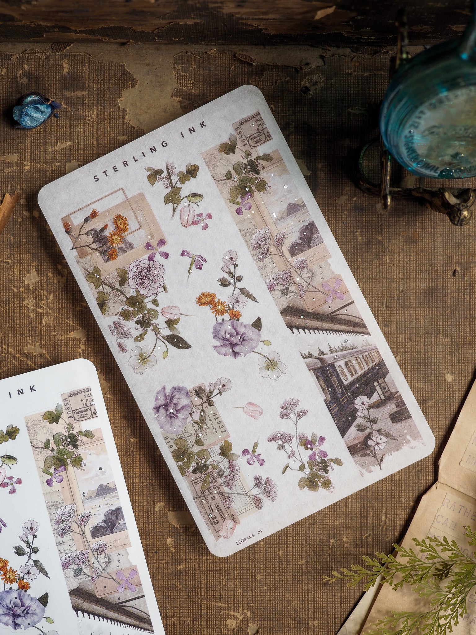 Decorative floral washi sticker strips featuring muted purple botanicals mixed with sepia-toned vintage print and botanical elements.