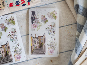 Decorative sticker sheet featuring vintage floral arrangements and charming watercolor buildings, perfect for August 2024 crafting and journaling.