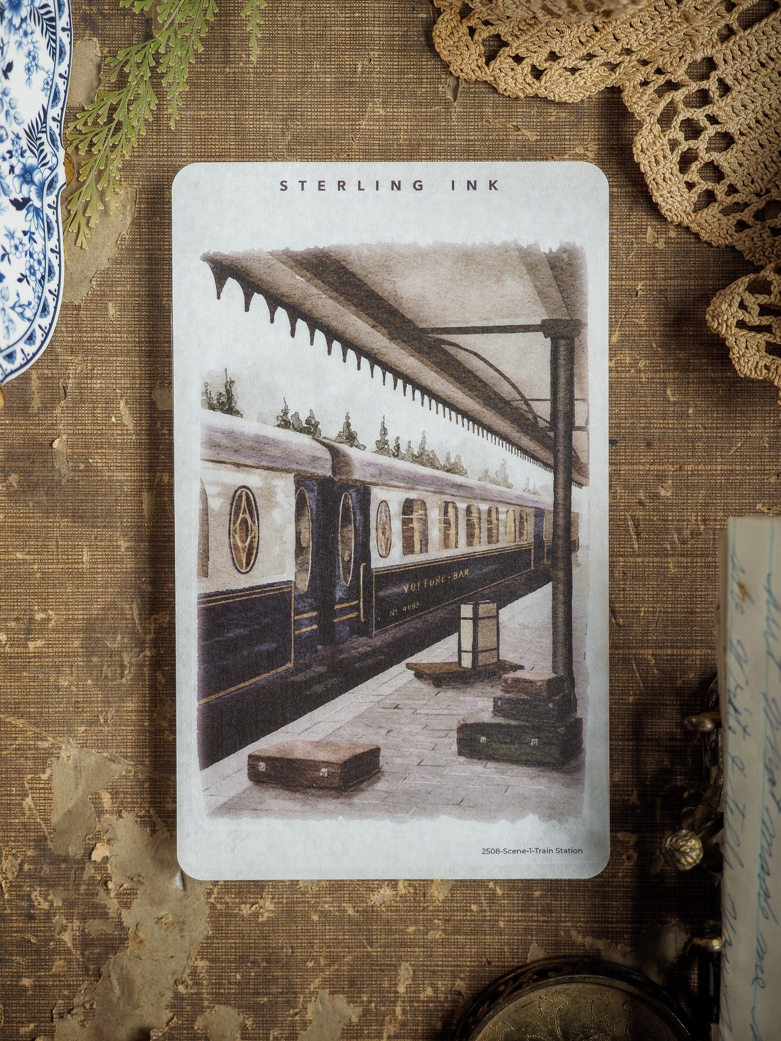 Detailed vintage illustration sticker showing a historic train pulling into a covered, rustic station platform, rendered in sepia tones.