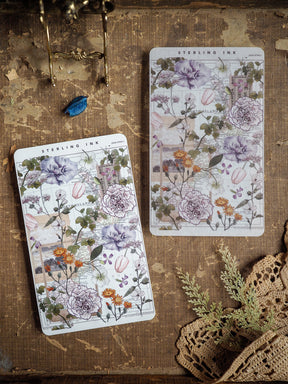 Delicate, cream-colored sticker strips showcasing lush botanical watercolor florals, including detailed roses and peonies in soft purple, blush, and green tones.