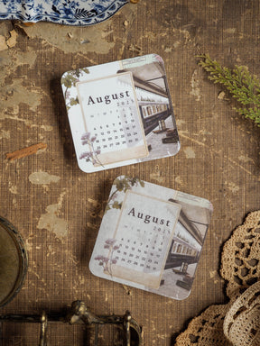 August 2025 monthly calendar stickers decorated with a vintage sepia-toned photograph of a covered wooden bridge.