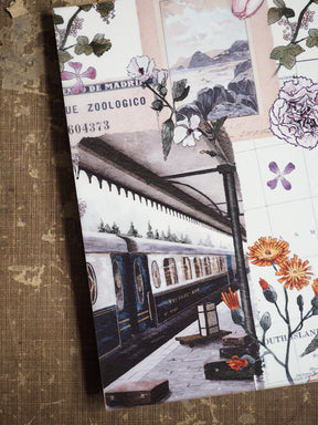 Vintage planner featuring a detailed black-and-white illustration of a historic train platform and locomotive, framed by delicate botanical sketches and soft typography.