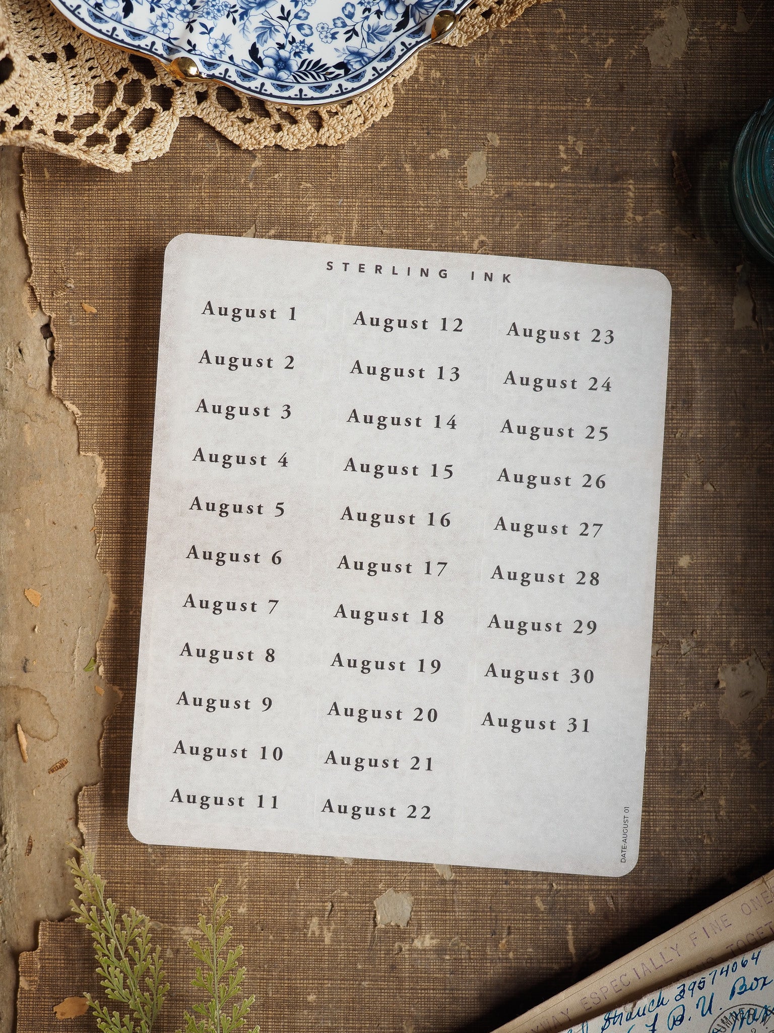 Pristine white August 2025 date stickers featuring 31 daily calendar dates printed in black ink, perfect for planning and journaling.