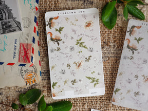 Delicate sticker sheet featuring a watercolor pattern of natural leaves, grasses, and golden wildflowers, ideal for journaling and scrapbooking decor.