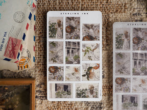 August 2023 stamp stickers featuring a collection of rustic vintage postage designs, centered around detailed architectural elements and lush green foliage.
