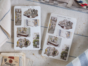 Detailed collection of "Sterling Ink" torn paper stickers showcasing charming, vintage architectural sketches of historic European city streets and buildings.