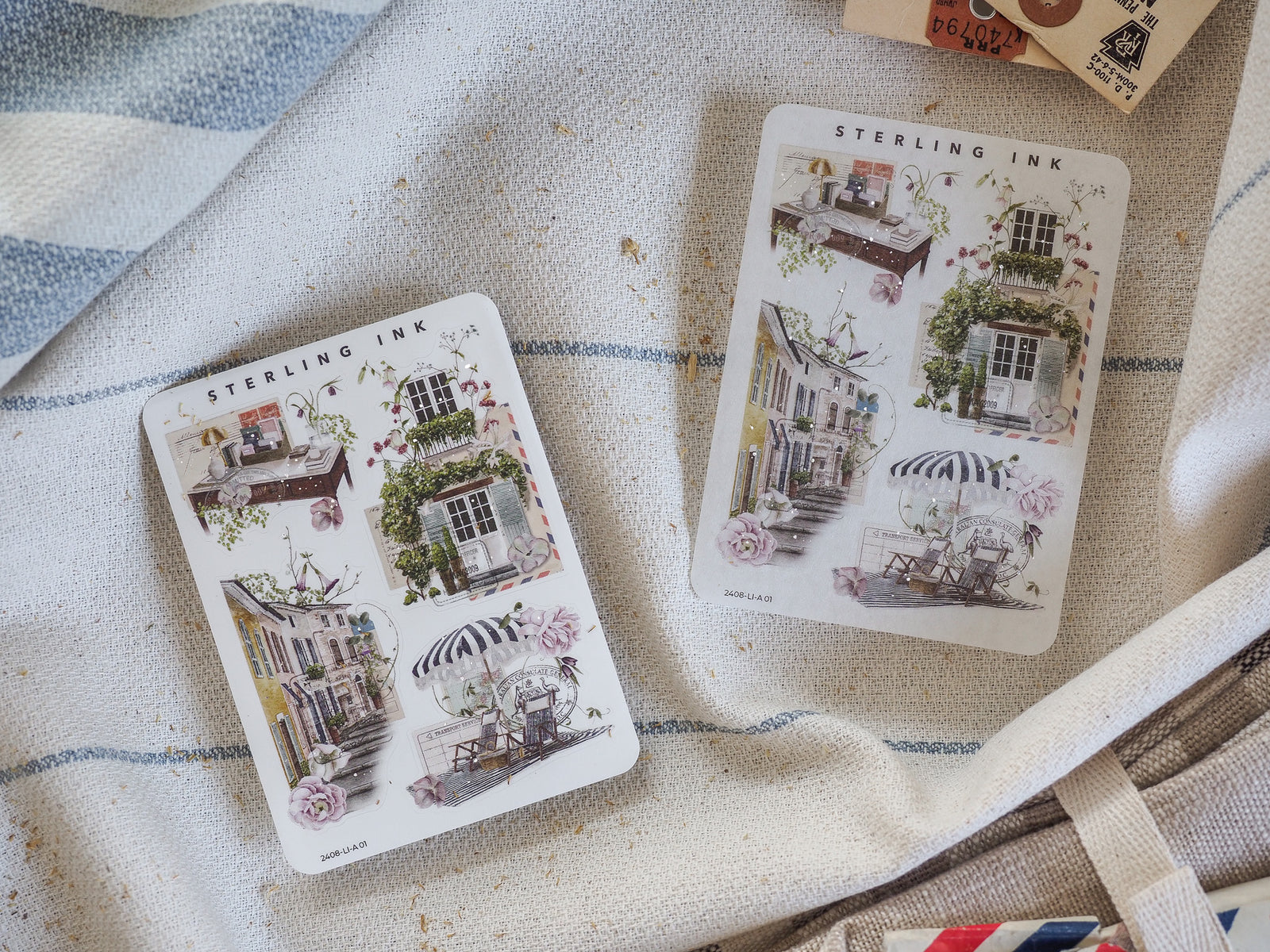 Vintage sticker set featuring detailed illustrations of romantic European street scenes, showcasing quaint Parisian buildings, striped awnings, and lush floral details.