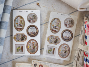 Vibrant sticker sheets featuring collectible, sepia-toned architectural sketches of detailed buildings arranged in vintage picture frames.