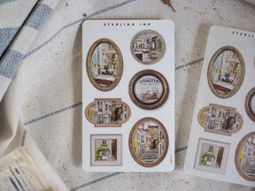 Vintage "Picture Frame Stickers" set featuring various ornate, gold-rimmed borders around miniature, architectural scenes of European city streets.
