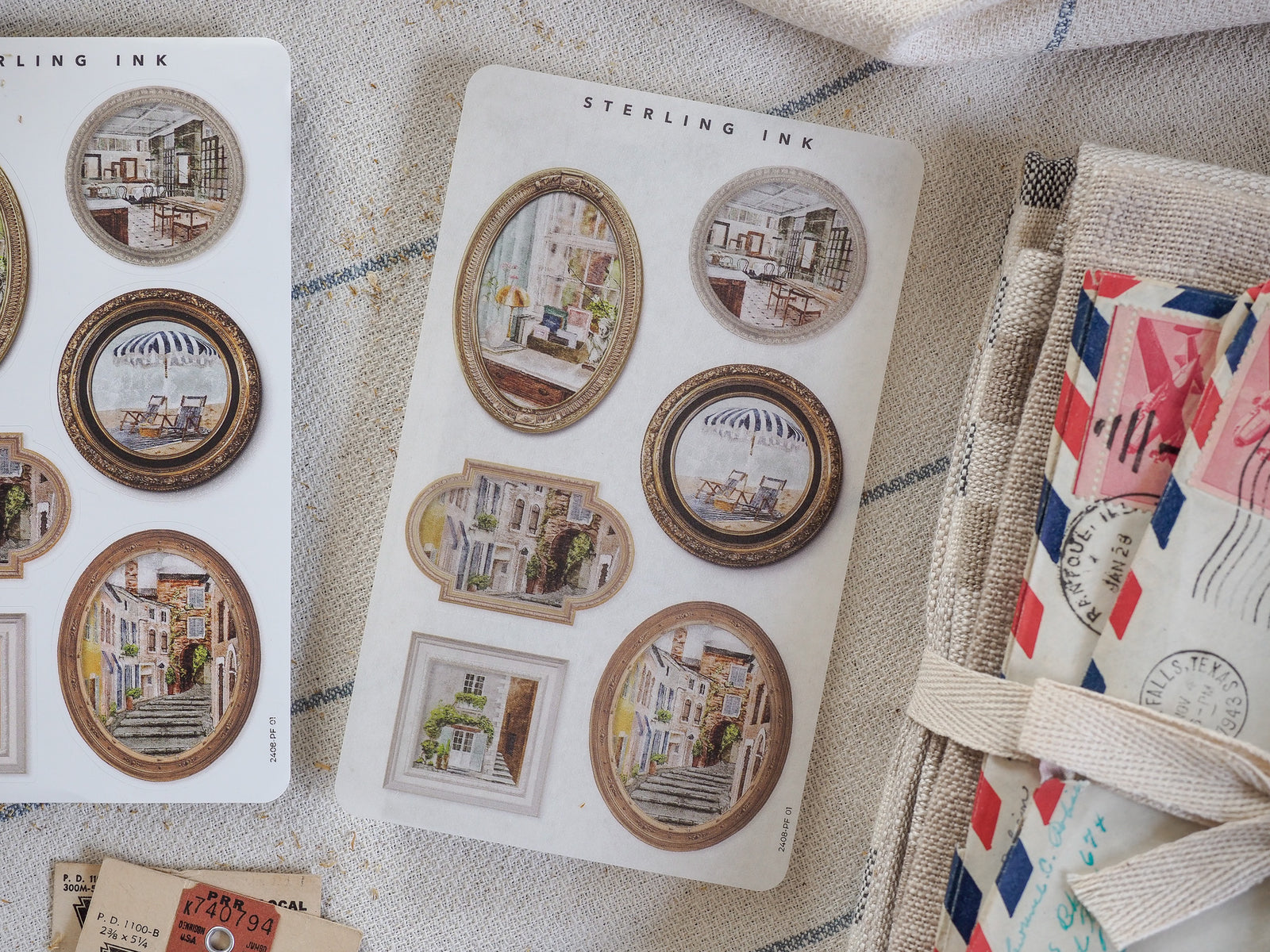 An assortment of vintage "Sterling Ink" picture frame stickers featuring nostalgic architectural scenes of Parisian and European street life.