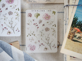 Pastel watercolor sticker sheet featuring delicate botanical elements, including blooming roses, wildflowers, and stems, perfect for decorating journals.