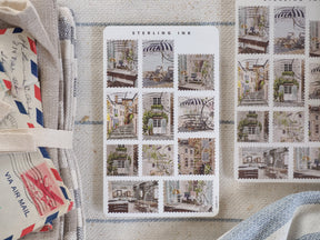 A vintage-style sticker sheet featuring a grid of sepia-toned images depicting charming, detailed European architecture and historic street scenes.