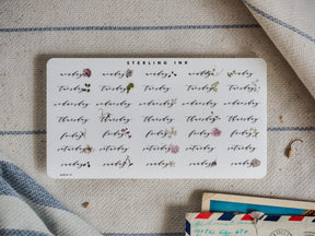 Planner sticker sheet for August 2024, featuring stylized typography for each weekday decorated with delicate watercolor floral and leaf accents.