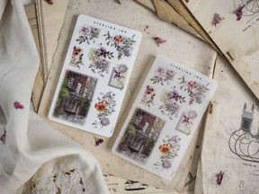 Sheet of "Arrangement Stickers - September 2024" featuring a blend of pale botanical illustrations, detailed floral clusters, and vintage brick building sketches.