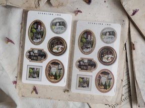 Vintage picture frame stickers featuring assorted circular and rectangular frames with sepia-toned illustrations of old architecture and houses.