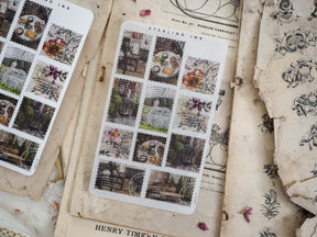 Vintage "Sterling Ink" stamp stickers featuring detailed black and white illustrations of charming outdoor street scenes and architectural details.