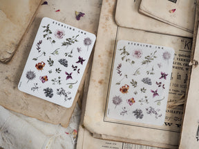 Botanical elements sticker sheet featuring detailed black and white botanical illustrations of leaves, flowers, and various natural elements from the Sterling Ink collection.