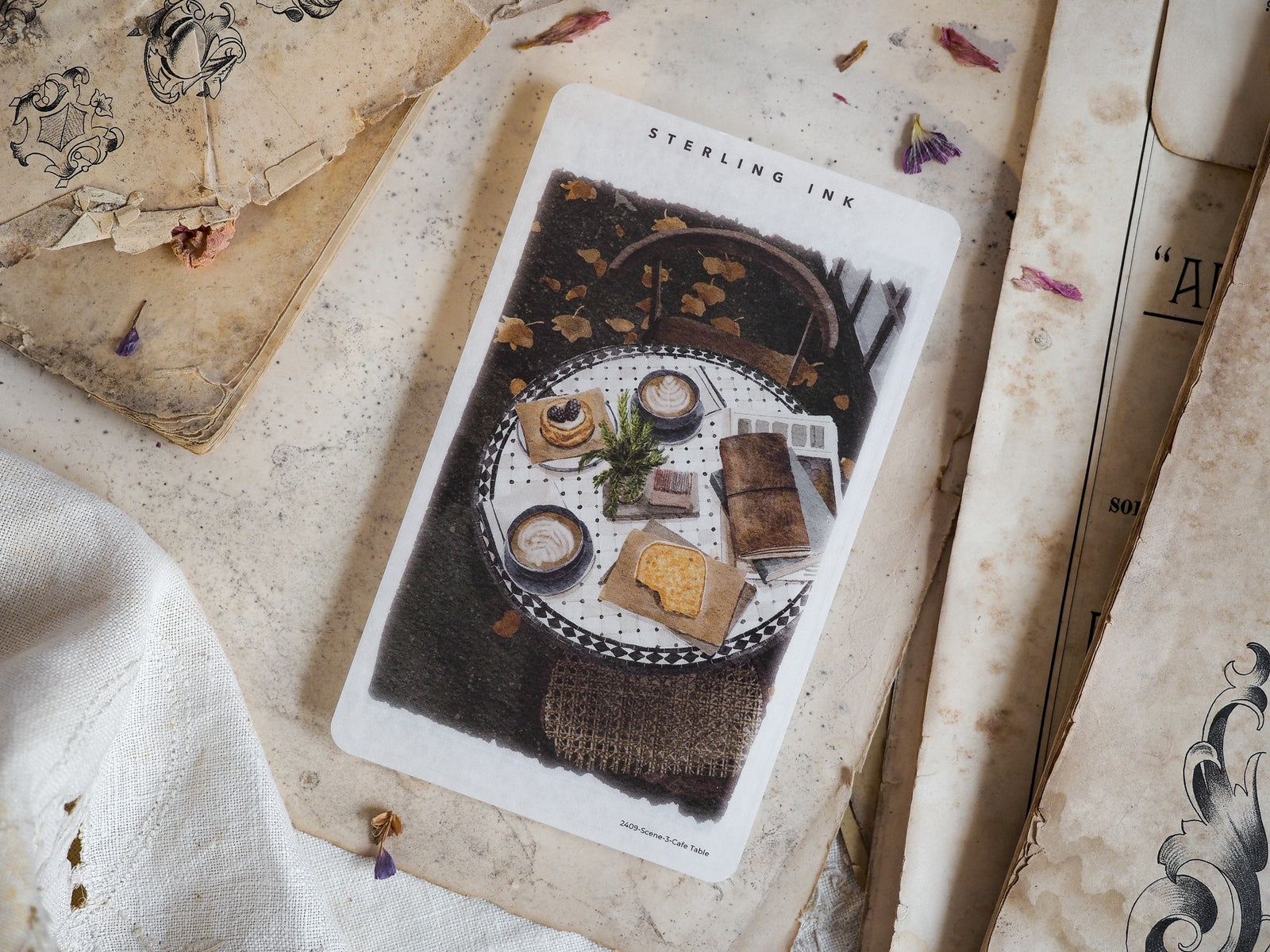 Overhead view sticker of a cozy, rustic cafe table setting, featuring small pastries, ceramic mugs, and warm, earthy brown tones.