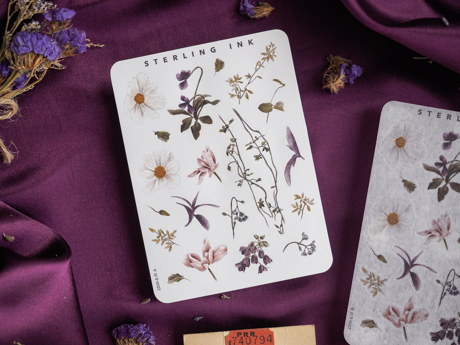 Botanical sticker sheet featuring delicate, hand-drawn watercolor illustrations of diverse flowers, leaves, and stems, perfect for scrapbooking and journaling.