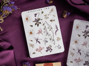 Botanical sticker sheet featuring delicate, hand-drawn watercolor illustrations of diverse flowers, leaves, and stems, perfect for scrapbooking and journaling.