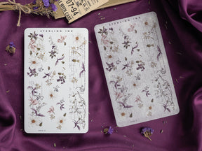 Cream washi sticker sheets adorned with delicate botanical illustrations, featuring a mix of dried lavender, woodland foliage, and vintage decorative elements.