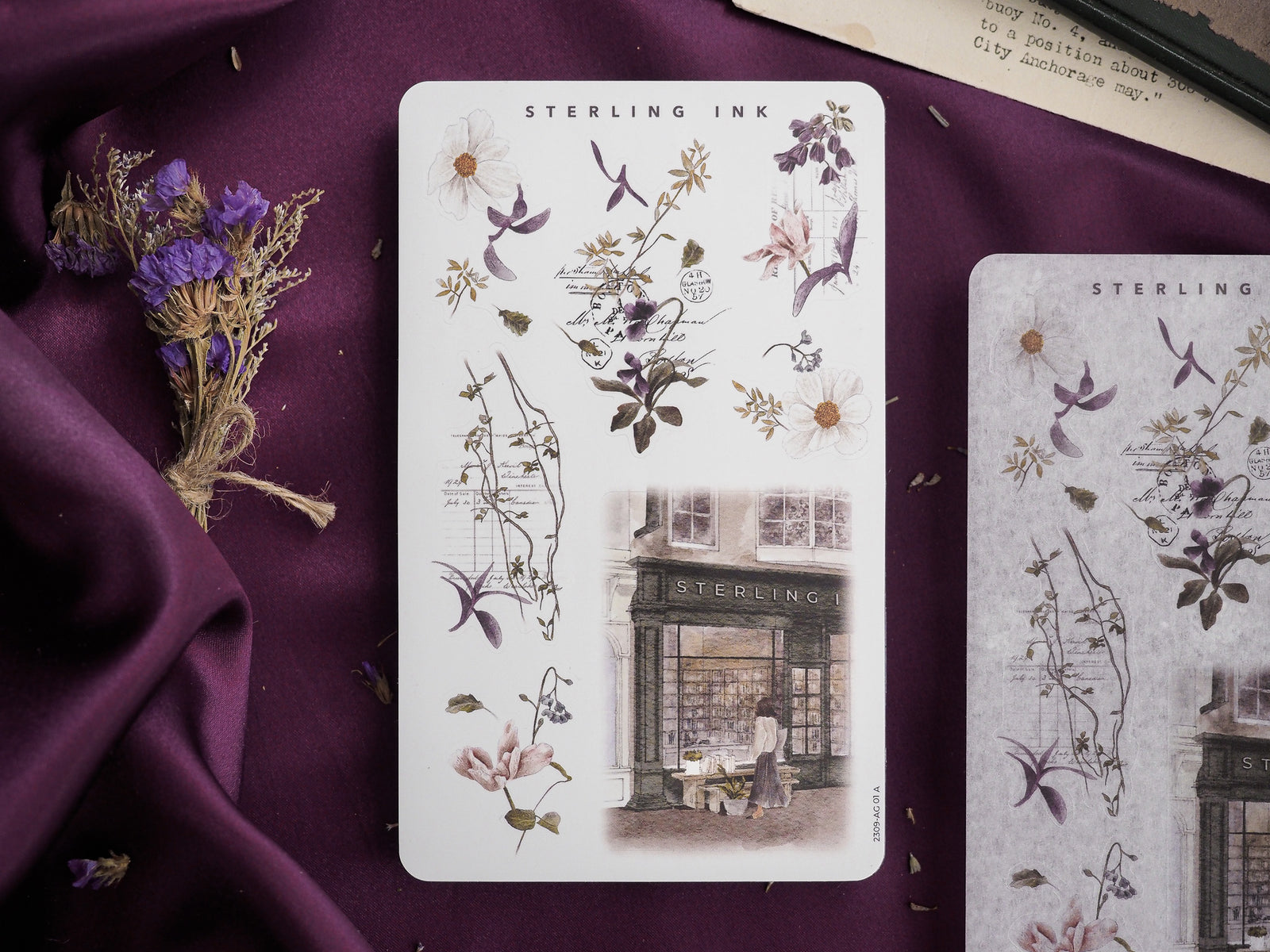 Botanical sticker sheet featuring delicate line drawings of wildflowers, detailed foliage, and a vintage watercolor sketch of a historic urban street.