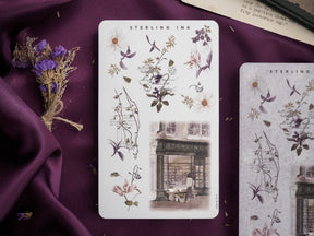 Botanical sticker sheet featuring delicate line drawings of wildflowers, detailed foliage, and a vintage watercolor sketch of a historic urban street.
