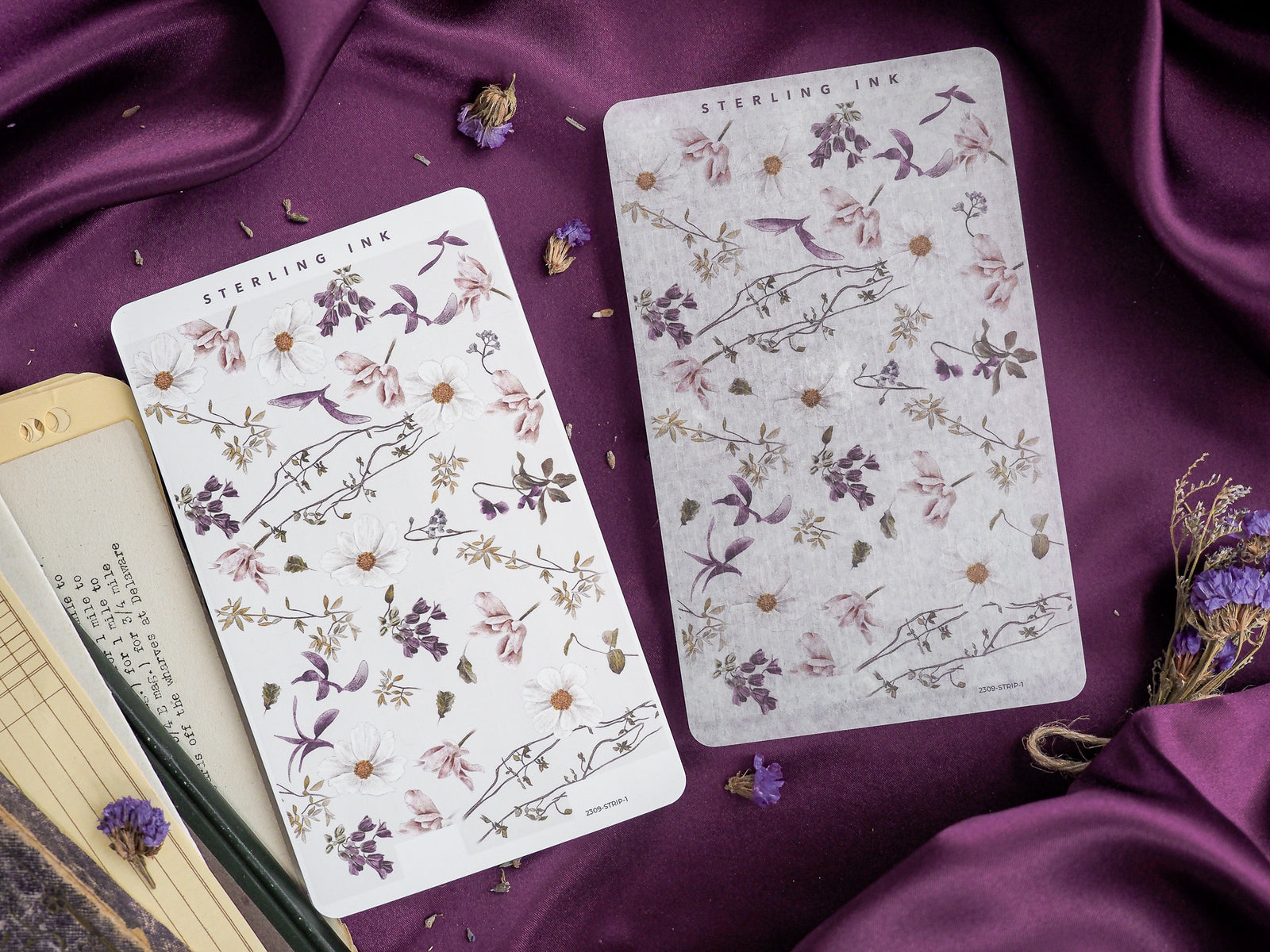 Elegant sticker sheets featuring a delicate, vintage botanical pattern of small flowers and leaves in muted mauves, creams, and dusty purples.