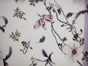 Captivating vintage botanical pattern featuring muted purples, creamy florals, and delicate branches in a seasonal, autumnal September design.