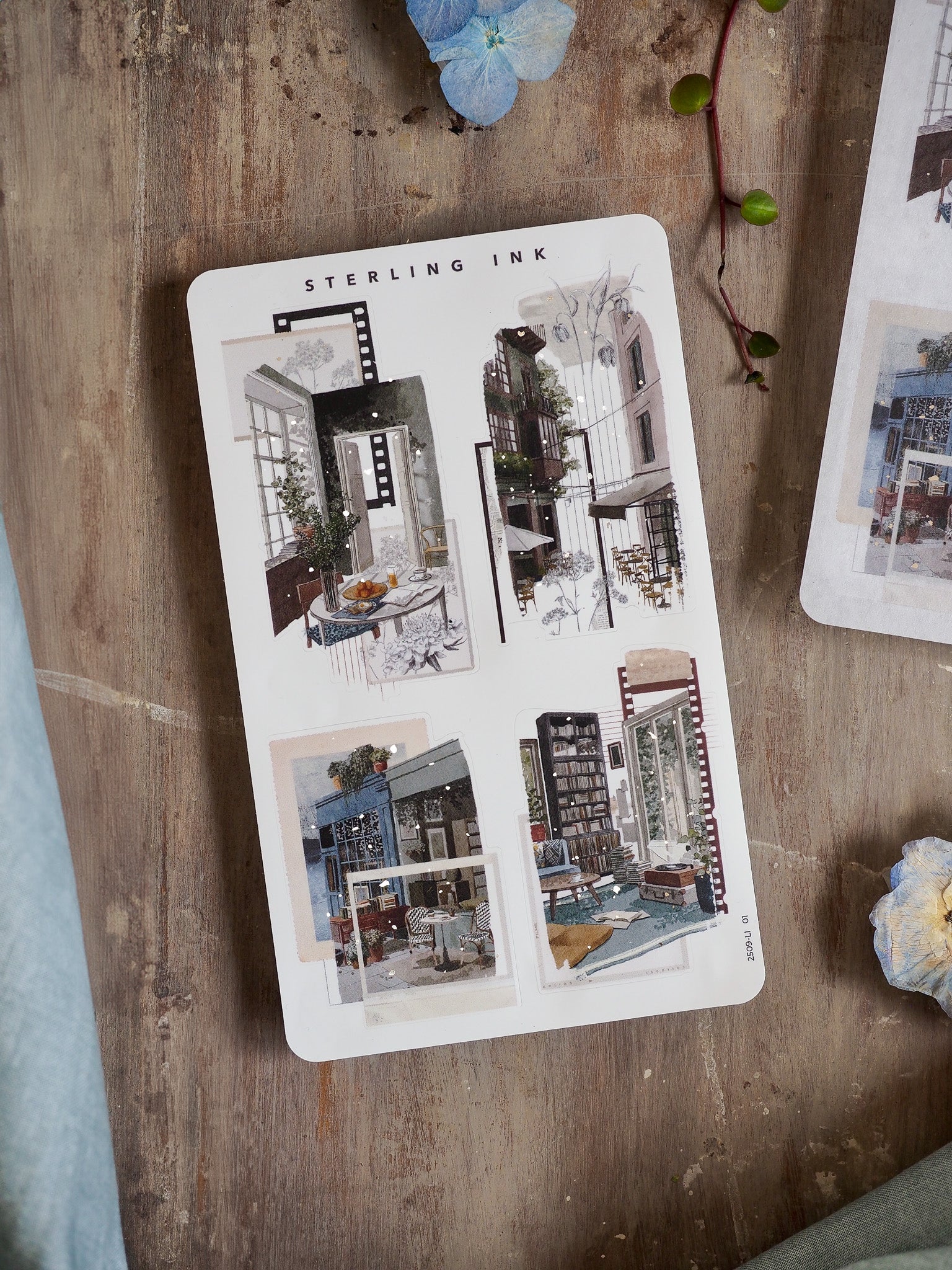 A detailed collage sticker sheet featuring diverse silver foil decals of vintage, artistic cityscapes, doorways, and modern architectural elements.