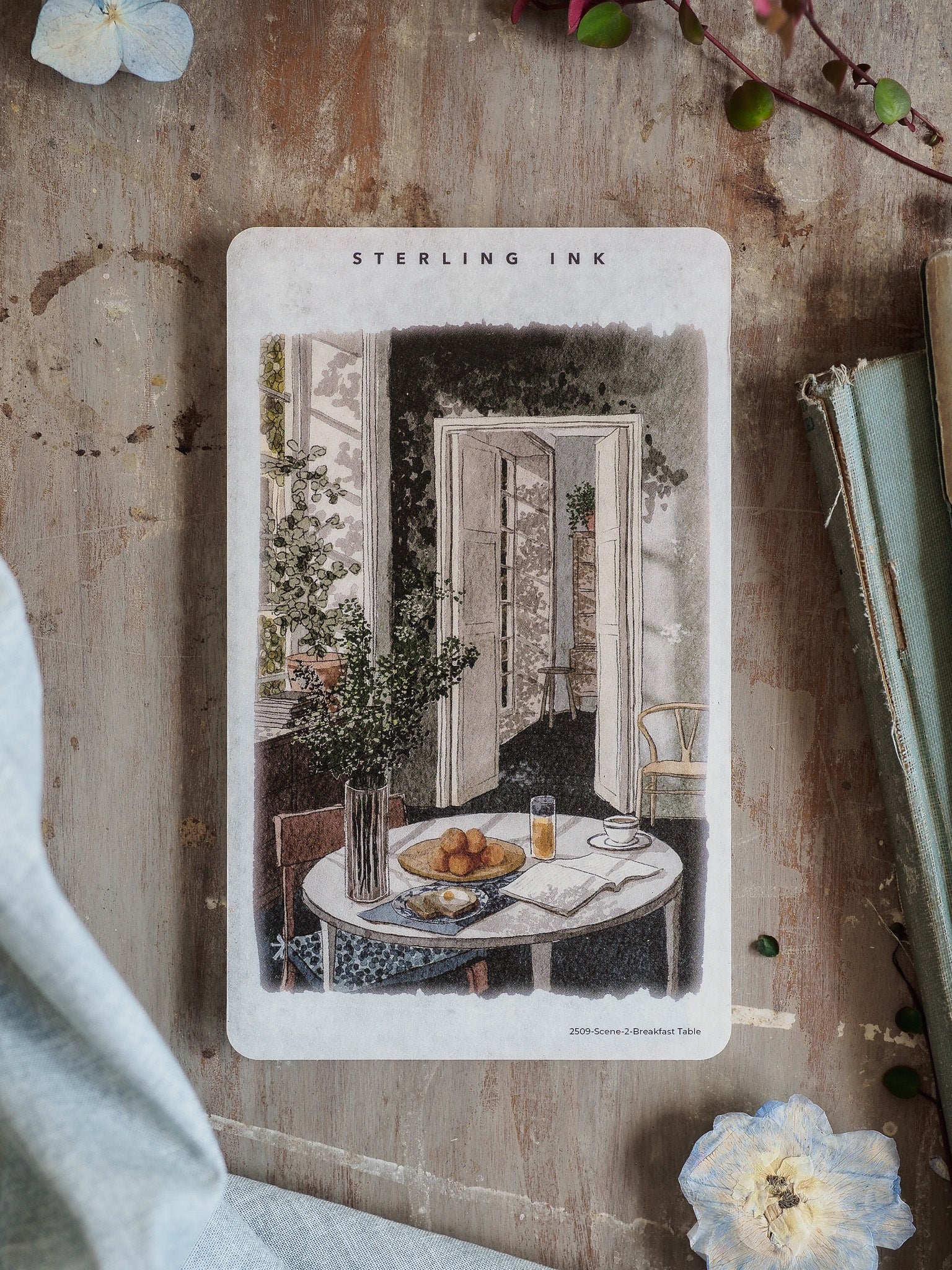 Vintage engraved illustration sticker of a serene breakfast table scene, featuring fresh flowers, fruit, and a cozy indoor setting.