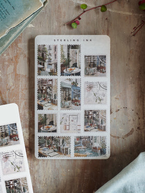 Vintage sticker sheet titled 'Sterling Ink' features a grid of sepia-toned illustrations depicting charming urban street scenes and historic architecture.