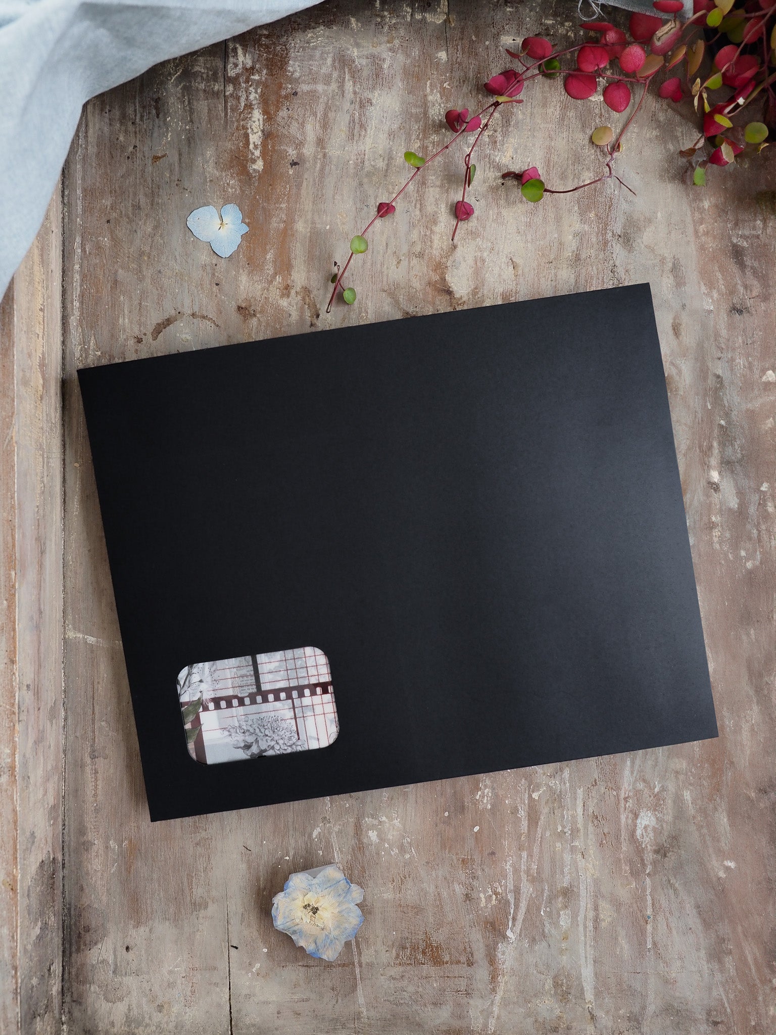 Matte black planning sheet featuring a patterned grid corner insert for seasonal tracking, perfect for September 2025 subscription kits.