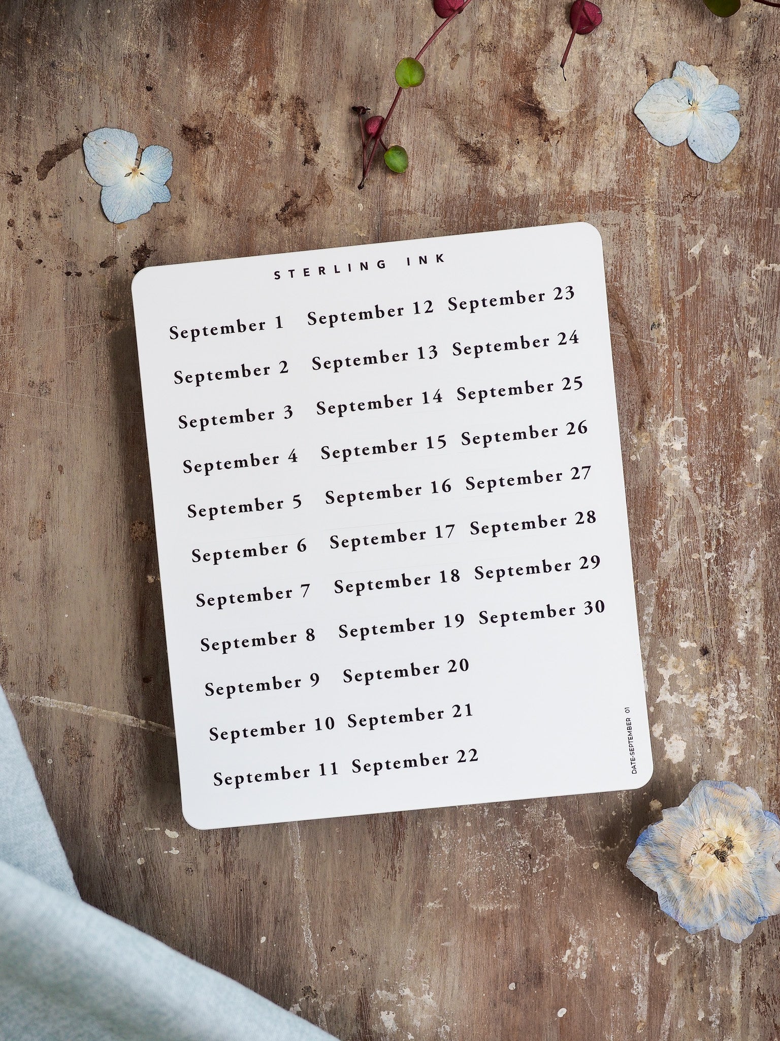 Minimalist sticker sheet featuring September 2025 dates, printed in elegant black typography on a clean white background for seamless journaling organization.