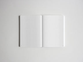 Open spiral notebook showcasing two blank pages of light gray graph paper, perfect for creative sketching, journaling, or academic tracking.