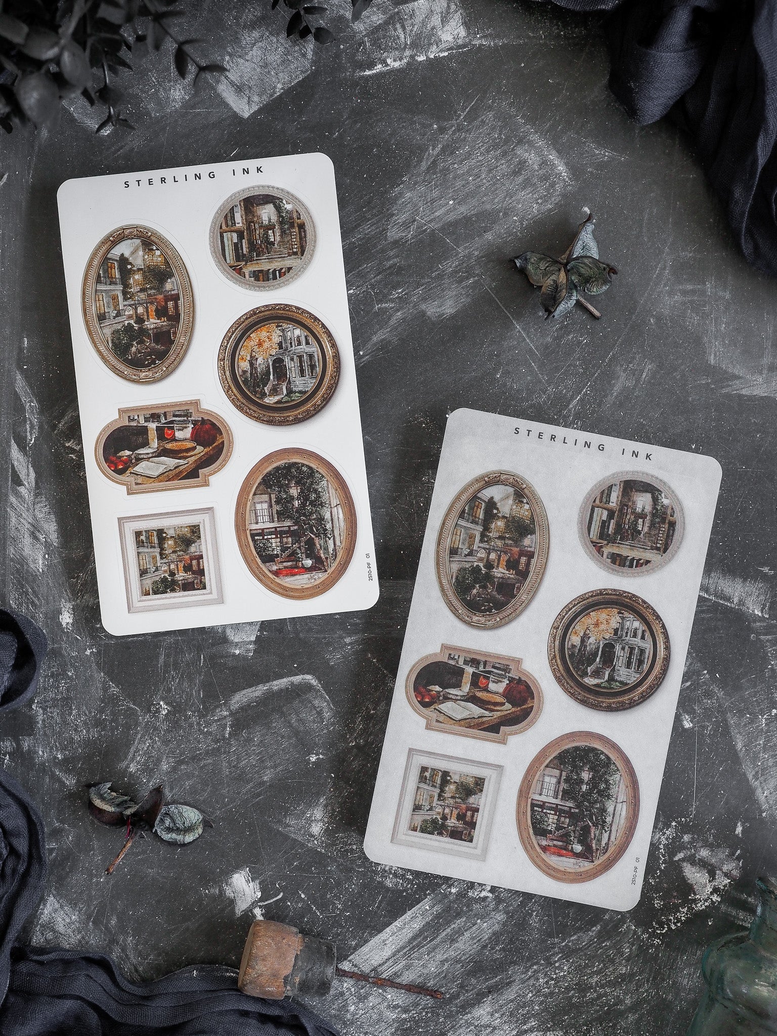 A collection of vintage-themed die-cut stickers featuring various ornate frames surrounding detailed, rustic vignettes of historic city streets and architecture.