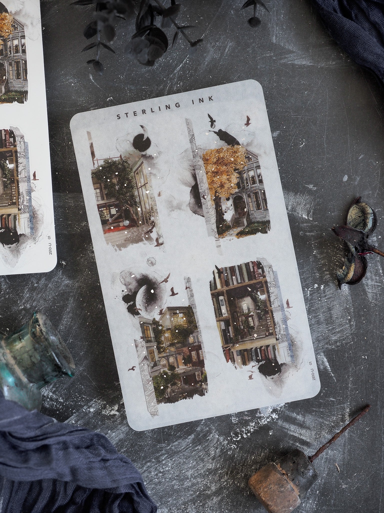 Collage sticker sheet featuring four panels of moody autumn cityscapes and detailed urban architecture with seasonal foliage and subtle silver foil accents.