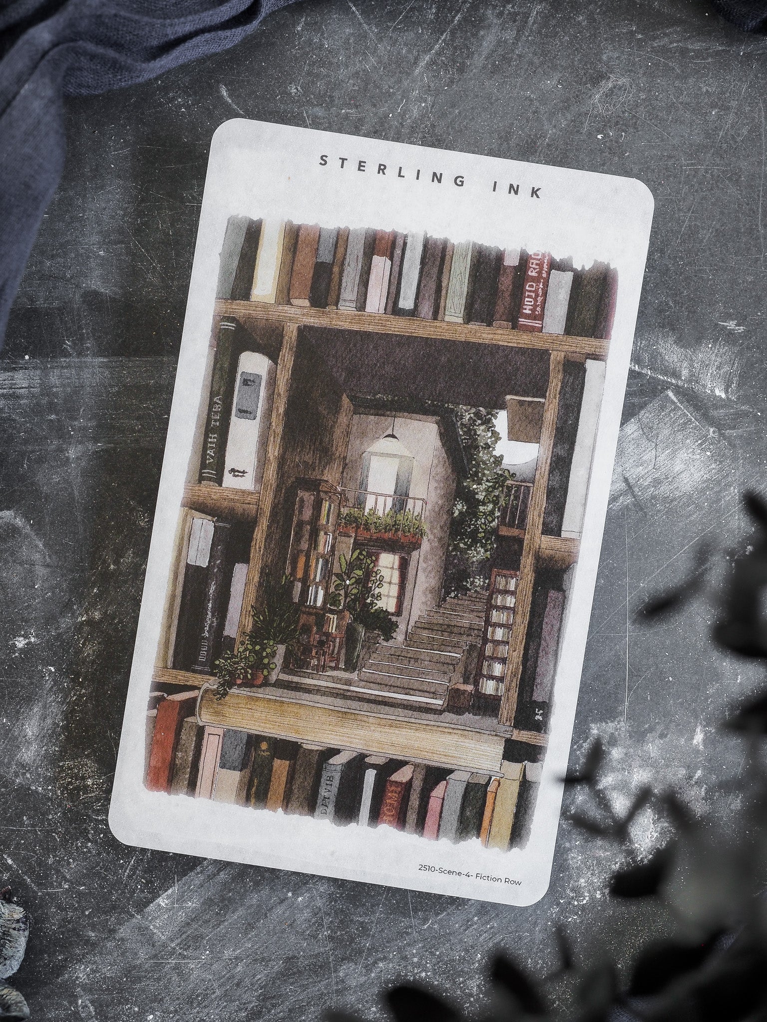 Detailed sticker illustration of a whimsical, multi-story facade, featuring stacked books, potted plants, and greenery, designed as "Fiction Row."