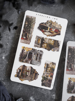 Sheet of distressed, vintage-style stickers showcasing charming autumnal street scenes and decaying European architecture with ivy and vines.
