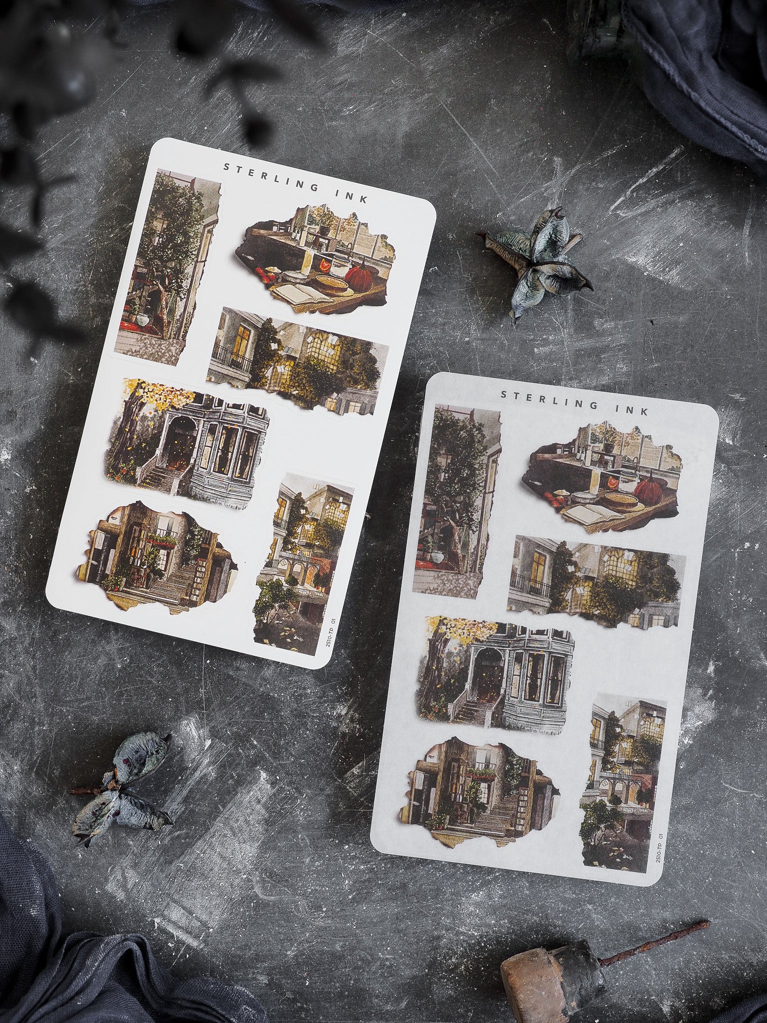 Clustered sheet of vintage, torn-edge stickers featuring sepia-toned illustrations of autumnal scenes and rustic architectural details for seasonal journaling.