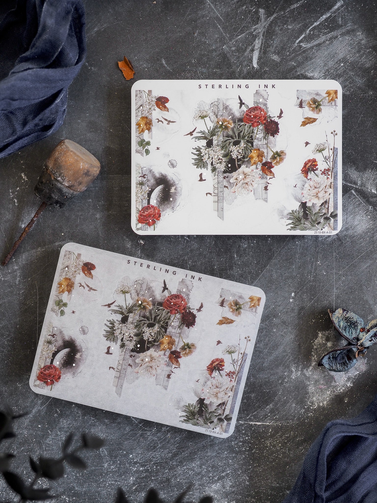 Rich autumnal corner embellishments featuring deep red roses, vintage botanical motifs, and seasonal foliage accented with brilliant silver foil.