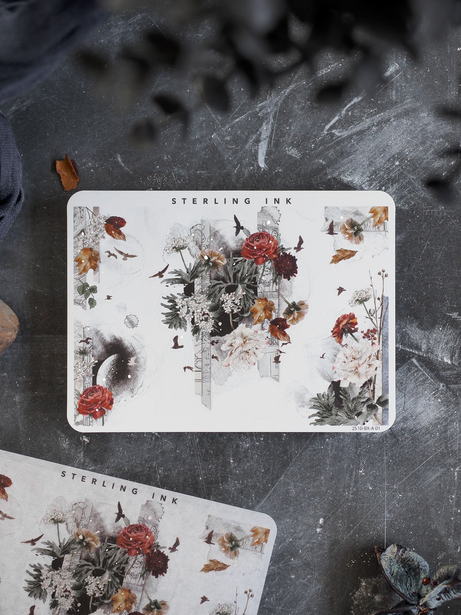 Vintage botanical sticker sheets depicting rich autumn arrangements, including deep red roses, delicate wildflowers, and scattered fall foliage.