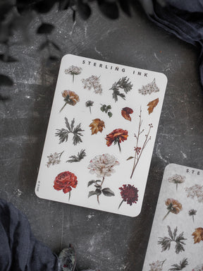Botanical sticker sheet featuring a detailed collection of realistic autumn elements, including various fall leaves, deep red and golden flowers, and assorted foliage.
