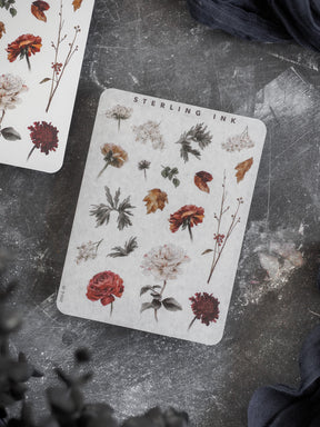 Botanical elements sticker set featuring rich autumn botanicals, including varied fallen leaves, deep red and cream flowers, and natural drawn foliage.