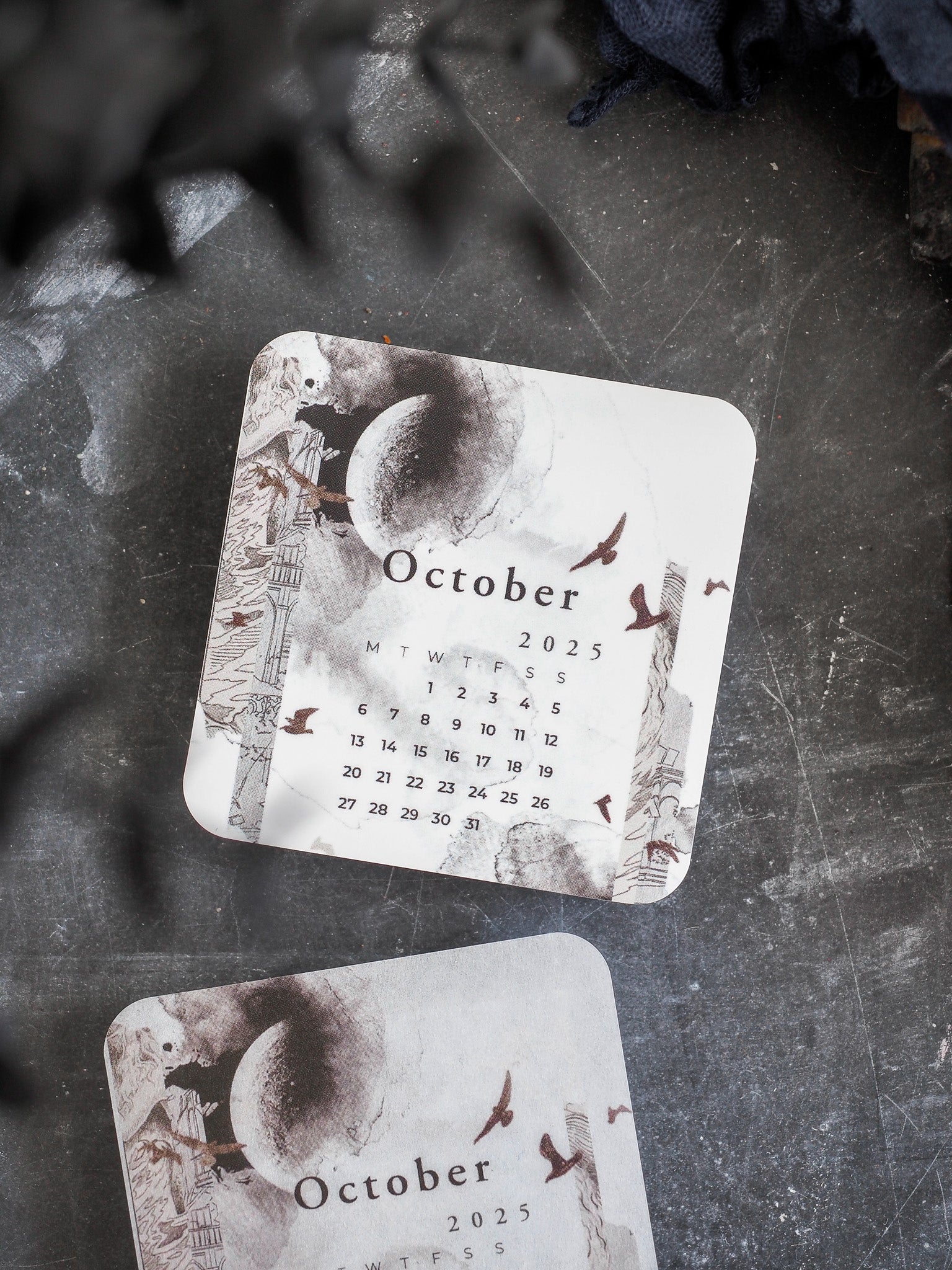 Vintage sepia calendar card for October 2025, featuring a central celestial sun and detailed surrounding architectural drawings.
