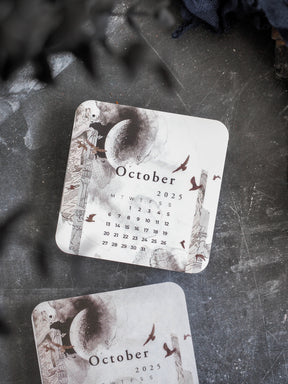 Vintage sepia calendar card for October 2025, featuring a central celestial sun and detailed surrounding architectural drawings.