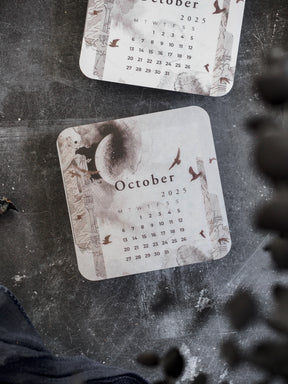 October 2025 monthly calendar featuring an autumnal watercolor design with decorative pumpkins, falling leaves, and rustic natural tones.