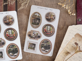 Vintage sticker sheet featuring various ornate photo frames surrounding detailed, nostalgic interior scenes of cozy, rustic rooms.