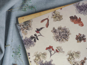 Elegant watercolor autumnal pattern featuring muted oak leaves, clusters of grey flowers, and berries, perfect for October journaling or scrapbooking.
